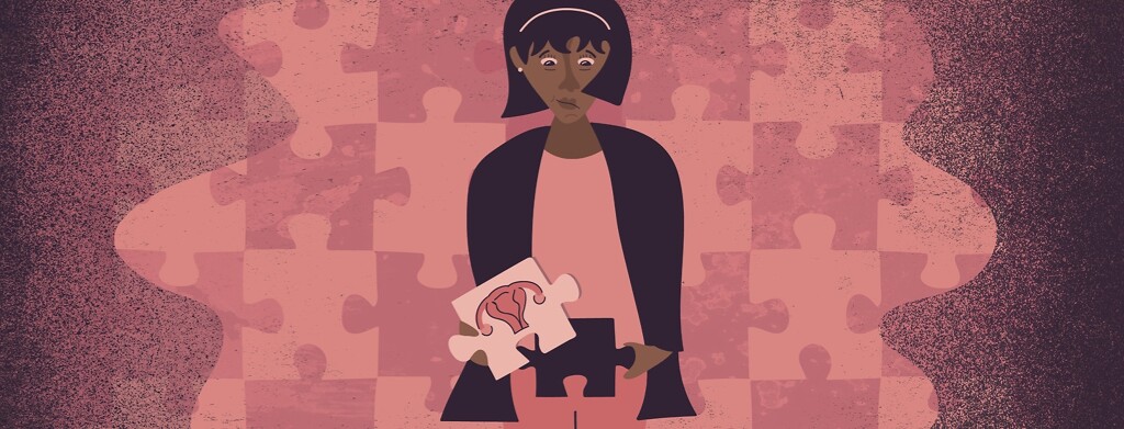 A woman holding a puzzle piece over her abdomen with a uterus on it