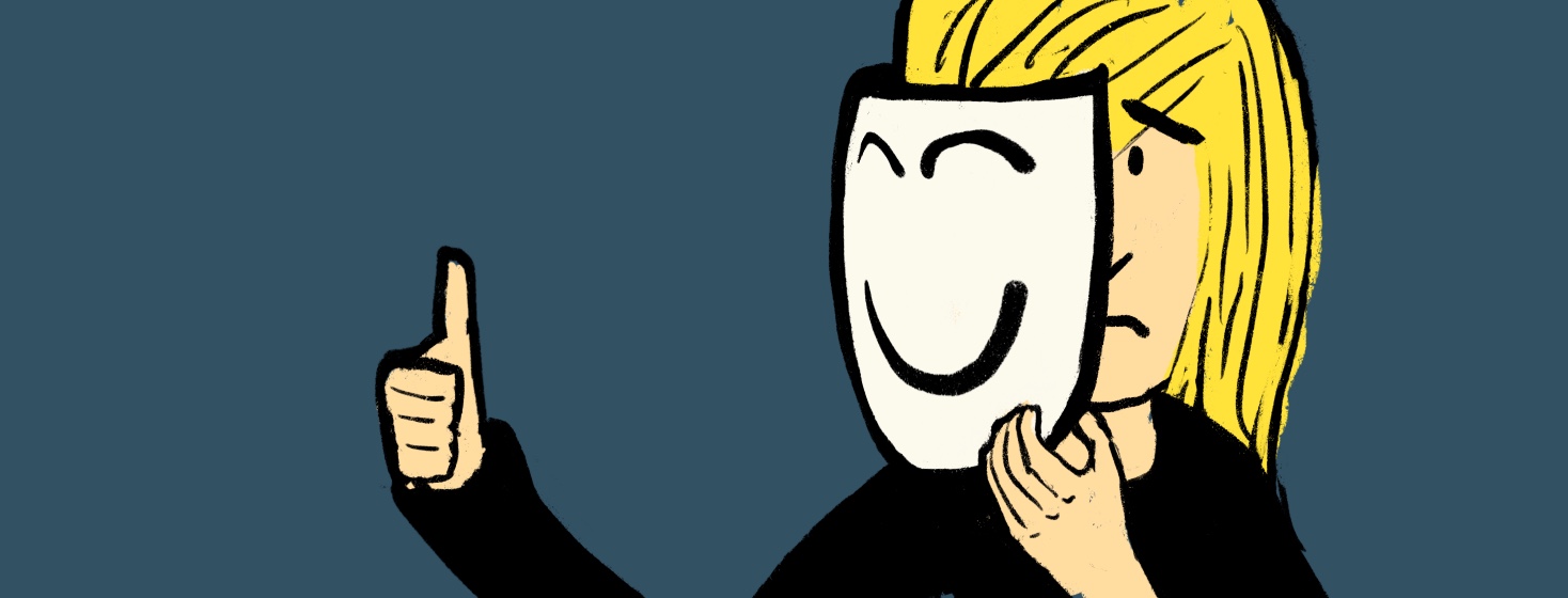 Woman giving thumbs up and holding a smiling mask over her face pretending to be happy when she's frowning and sad