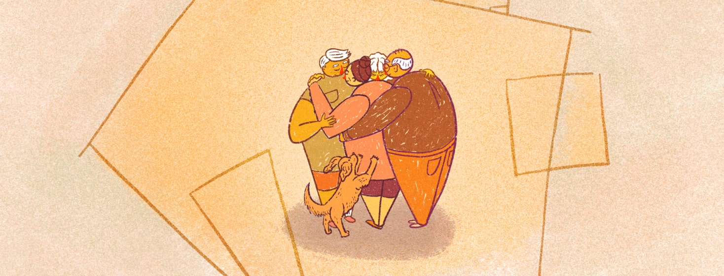 A family huddled in a hug in the frame of a house