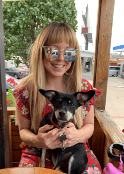 Image of a woman holding a puppy